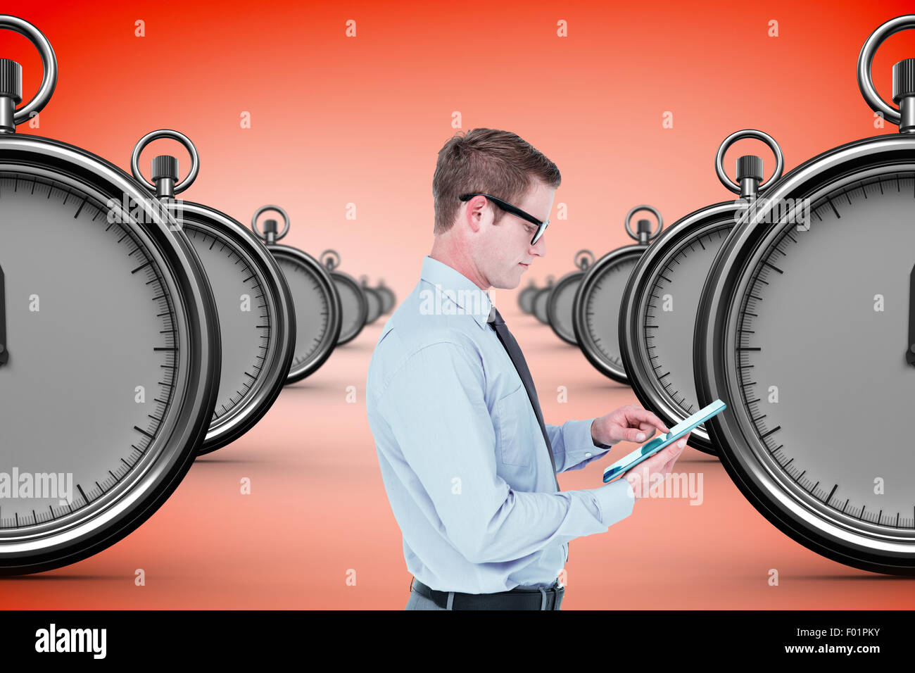Composite image of handsome businessman using tablet Stock Photo