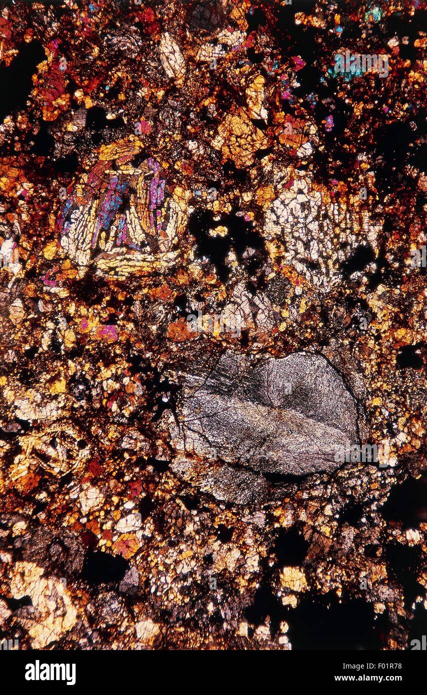 Iperstenic Chondrite, stony meteorite, from L'Aigle (Normandy, France), thin section, using crossed Nicols, 14x1,3. Stock Photo