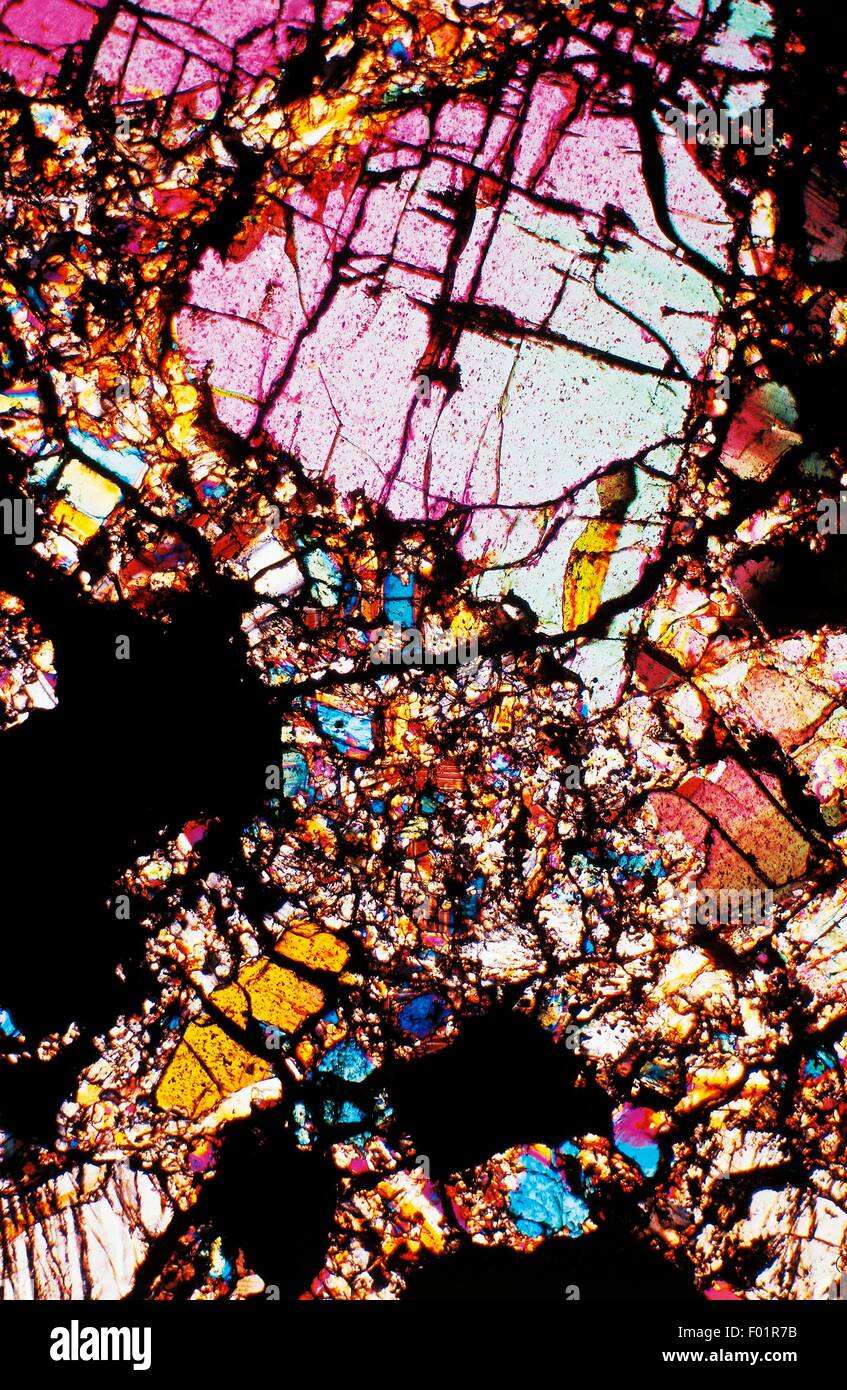 Mesosiderite, stony-iron meteorite, from Mincy (Missouri, Stati Uniti), thin section, using crossed Nicols, x27x1,5. Stock Photo