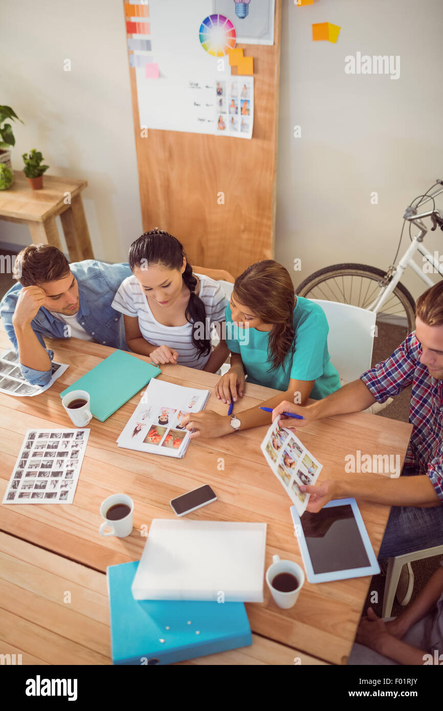 Seated creative business team working together Stock Photo - Alamy