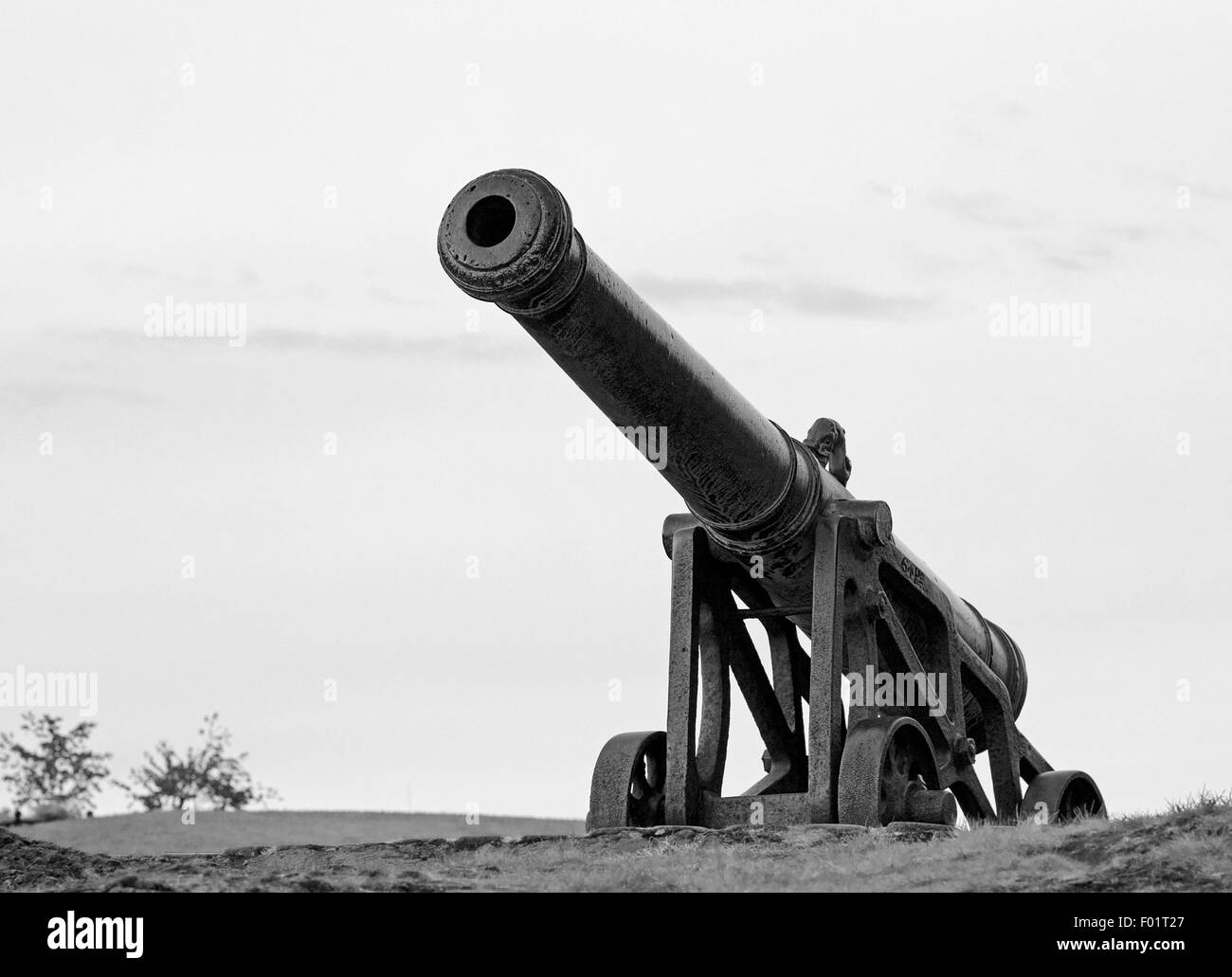 Looking up at the Portuguese Cannon on Calton Hill, Edinburgh, semi-silhouetted against a clear sky, Scotland UK Stock Photo