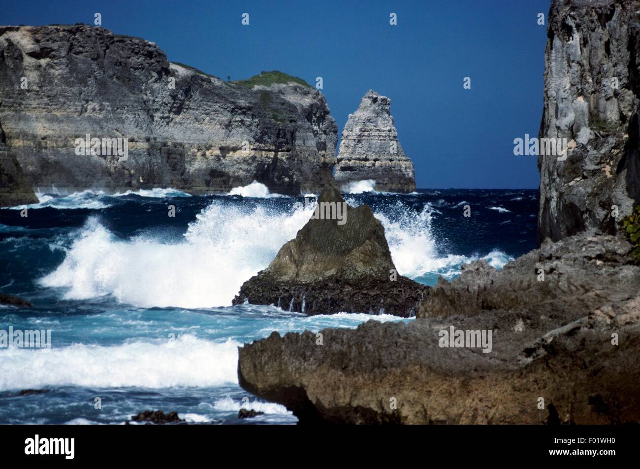 Waves breaking on the rocks of Porte d'Enfer bay, Guadeloupe (French Overseas Territory). Stock Photo