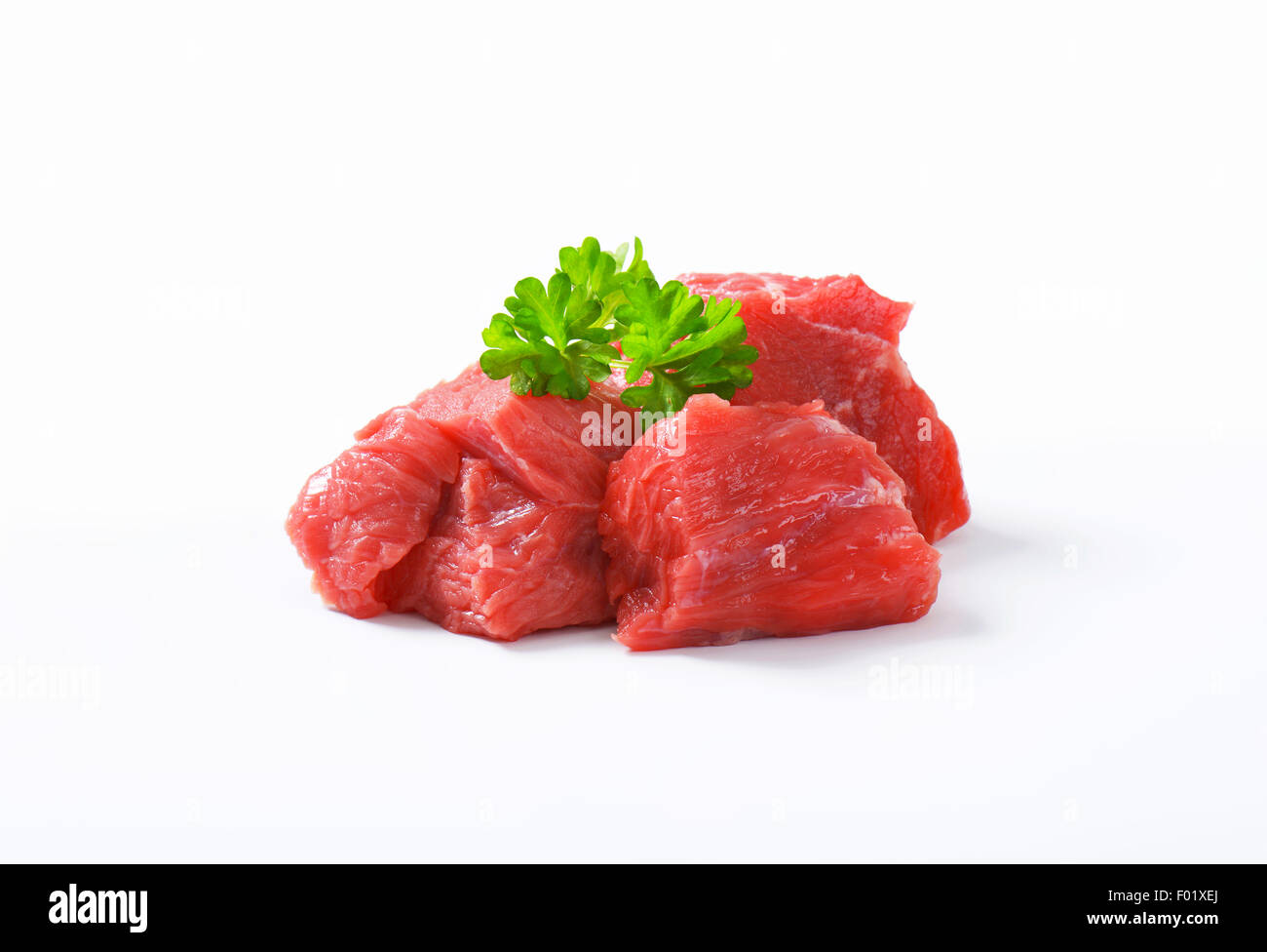 Raw beef cut into cubes Stock Photo Alamy