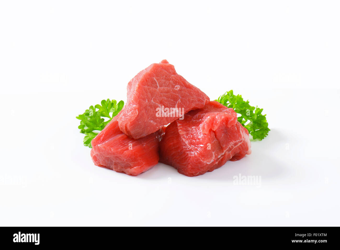 Raw beef cut into cubes Stock Photo Alamy