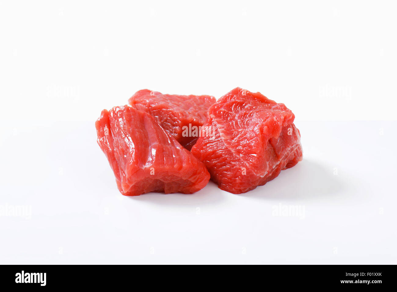 Raw beef cut into cubes Stock Photo Alamy
