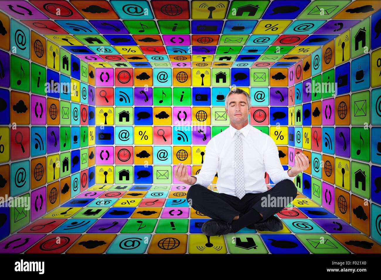Composite image of zen businessman meditating in lotus pose Stock Photo