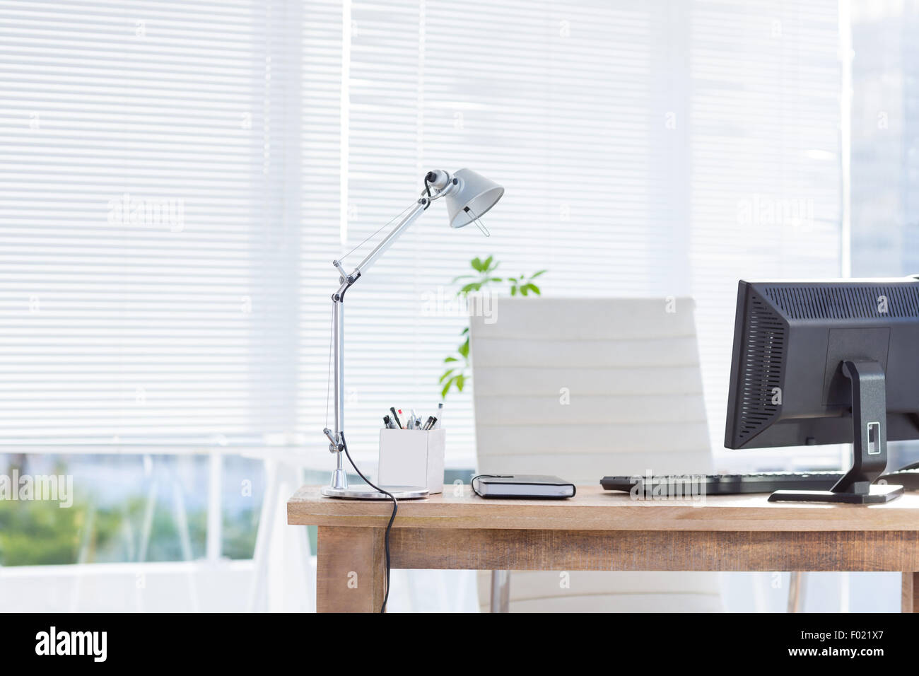 Computer and notebook on the desk Stock Photo - Alamy
