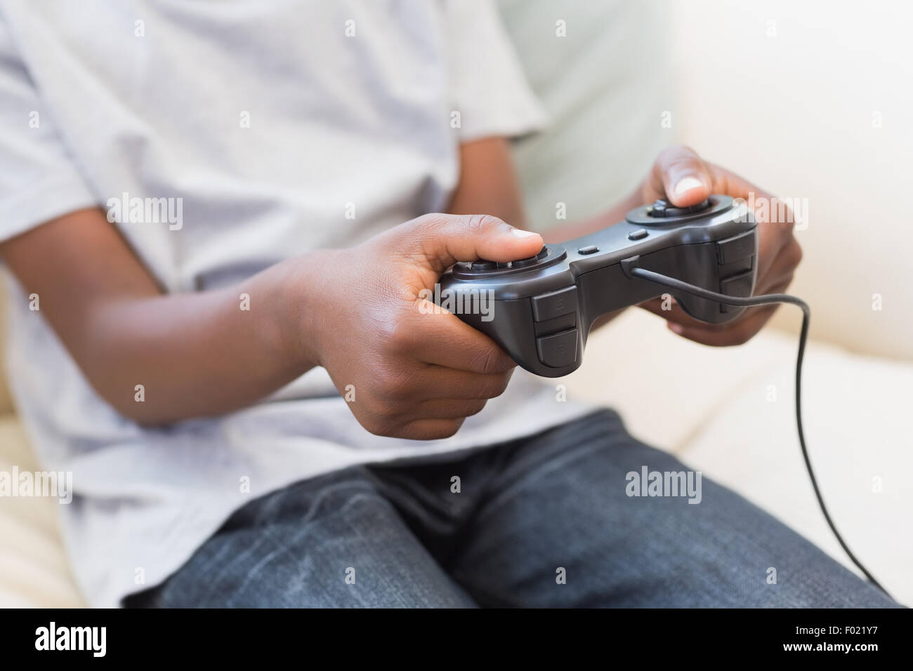 Little boy playing video games Stock Photo