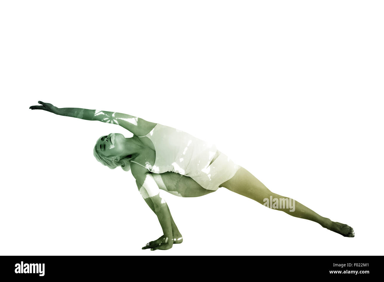 Composite image of full length of a sporty young woman practicing yoga Stock Photo