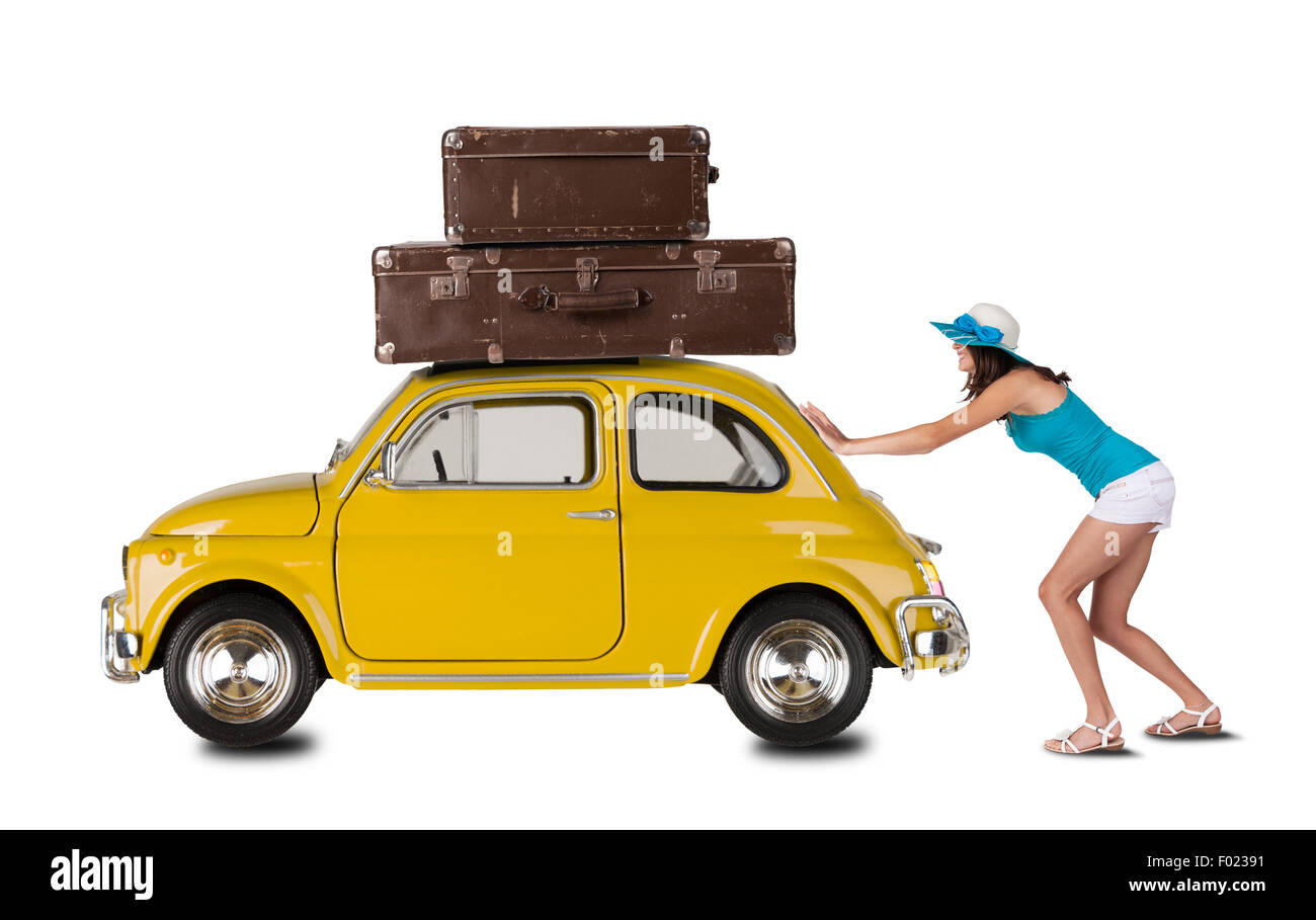 Young woman pulling car with suitcases Stock Photo Alamy