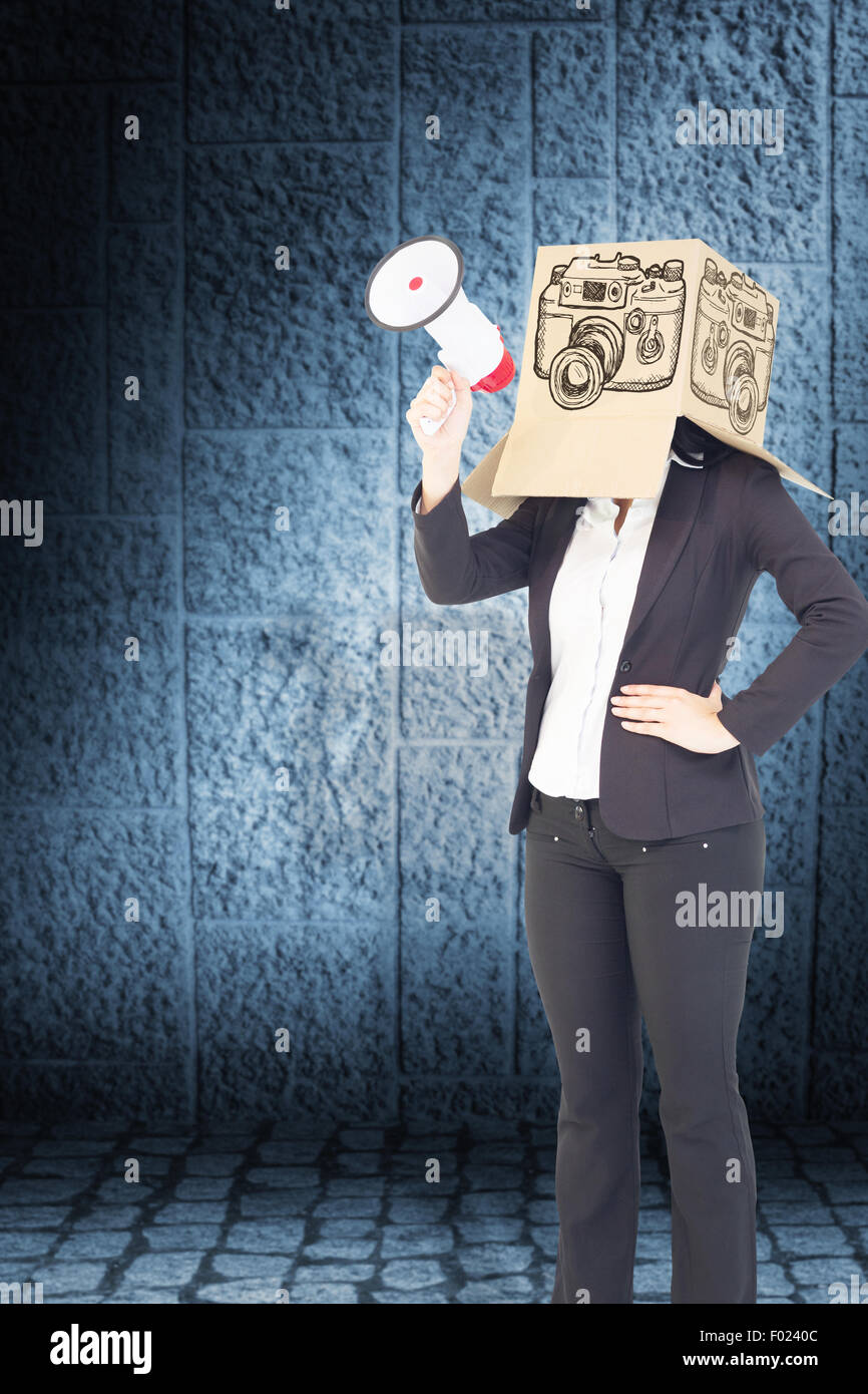Composite image of anonymous businesswoman holding a megaphone Stock Photo