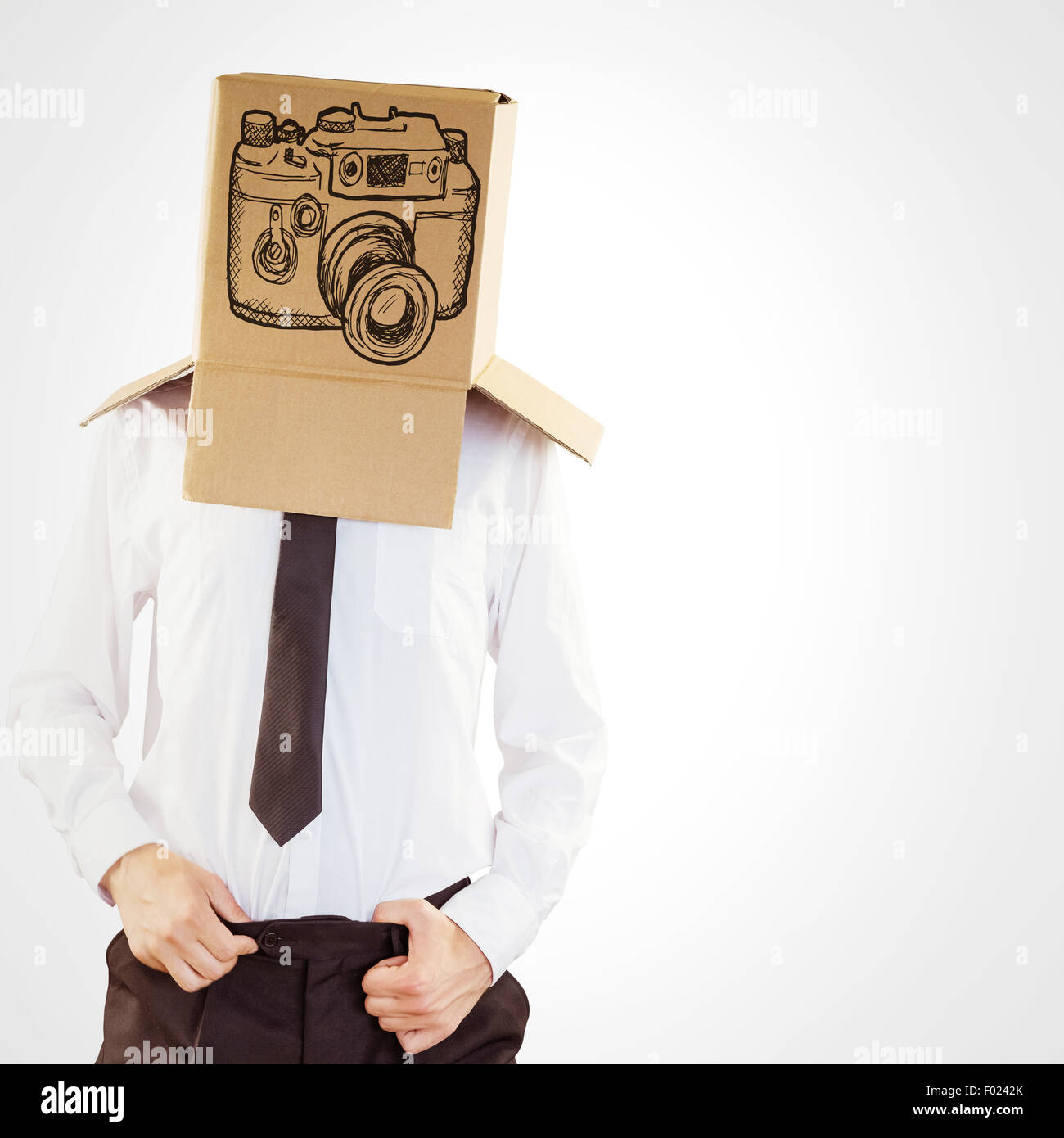 Composite image of anonymous businessman with hands in waistband Stock Photo