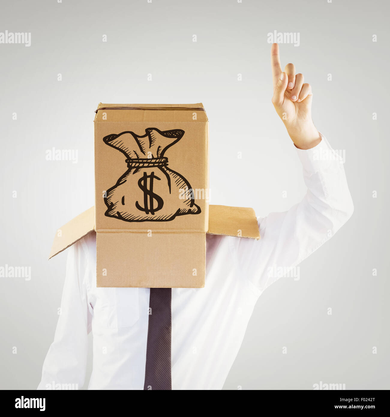 Composite image of anonymous businessman with hand pointing up Stock Photo
