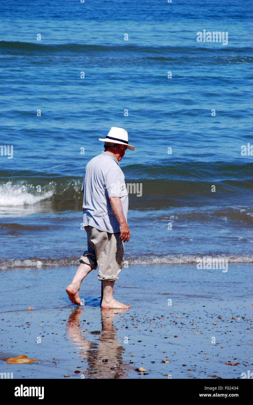 A stroll along the water's edge on a warm and sunny day Stock Photo