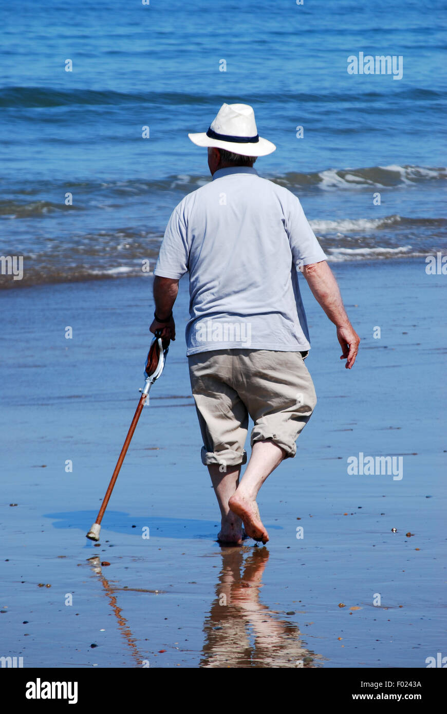 A stroll along the water's edge on a warm and sunny day Stock Photo