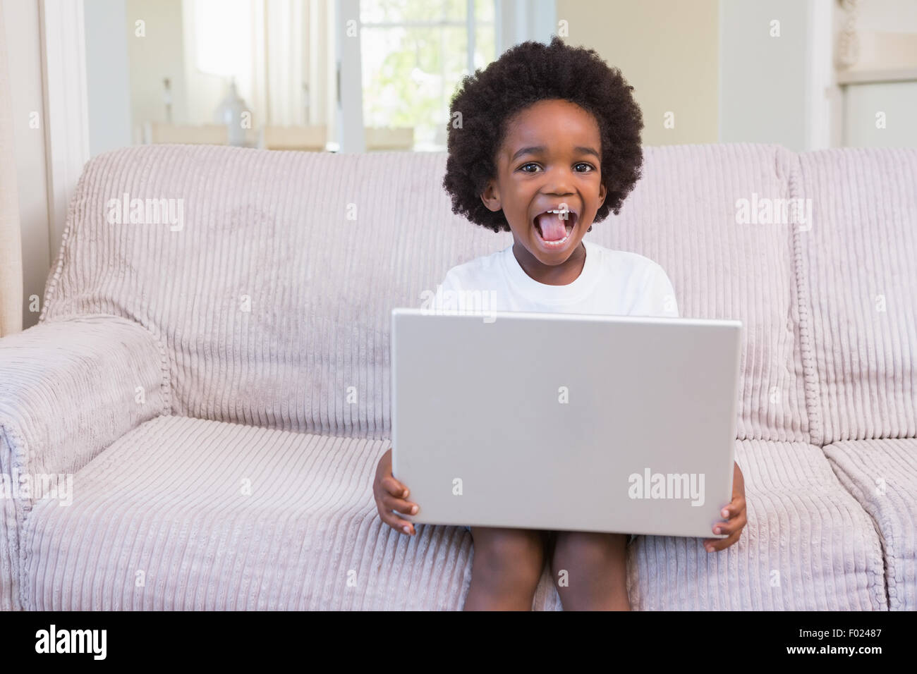 Little boy using a laptop Stock Photo - Alamy