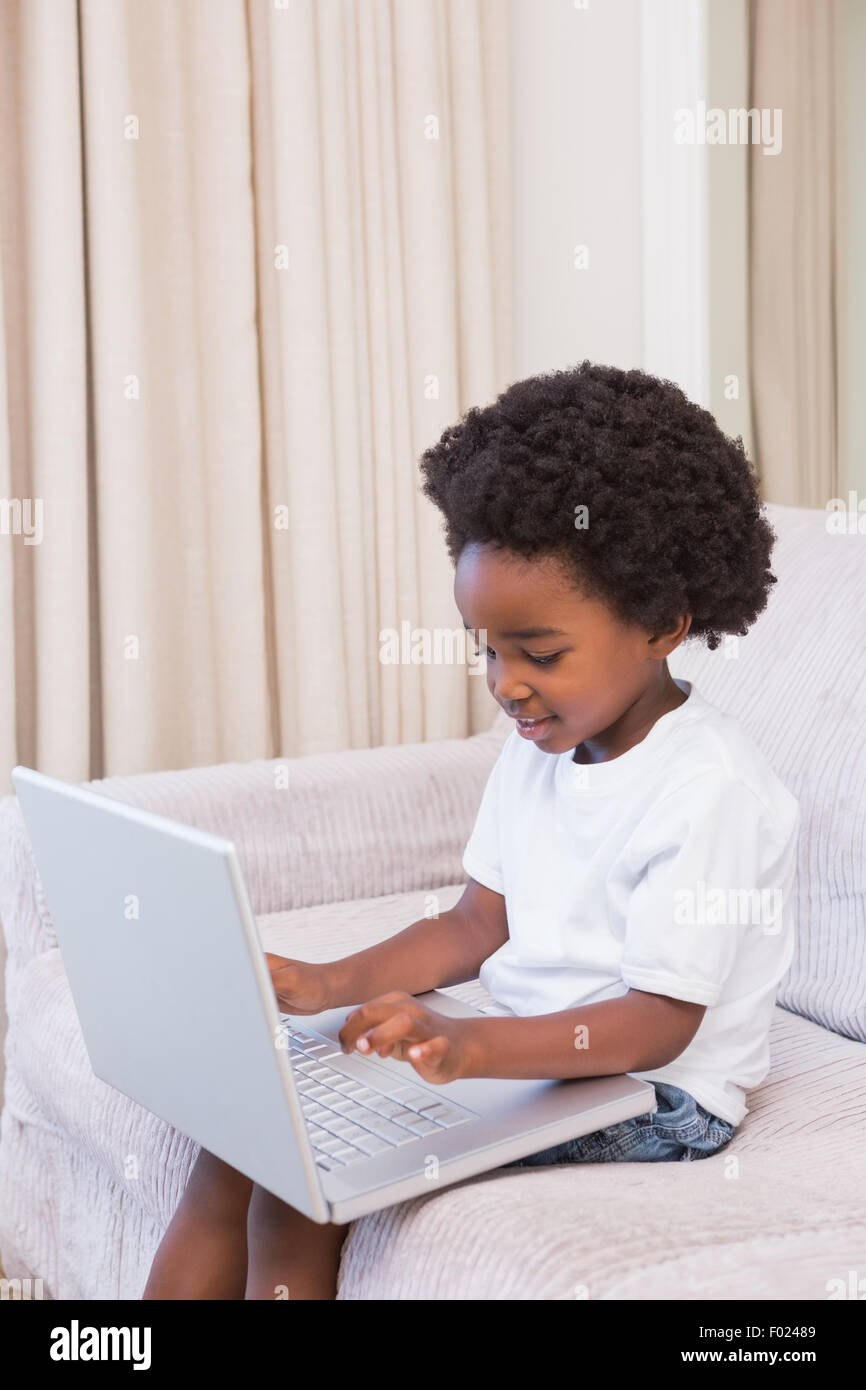 Little boy using a laptop Stock Photo - Alamy
