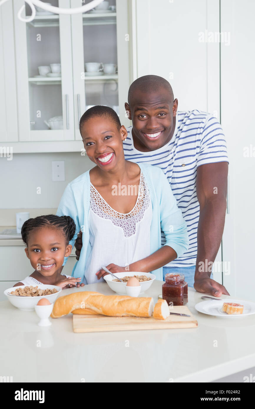 Portrait of a happy family sitting and taking breakfast Stock Photo - Alamy