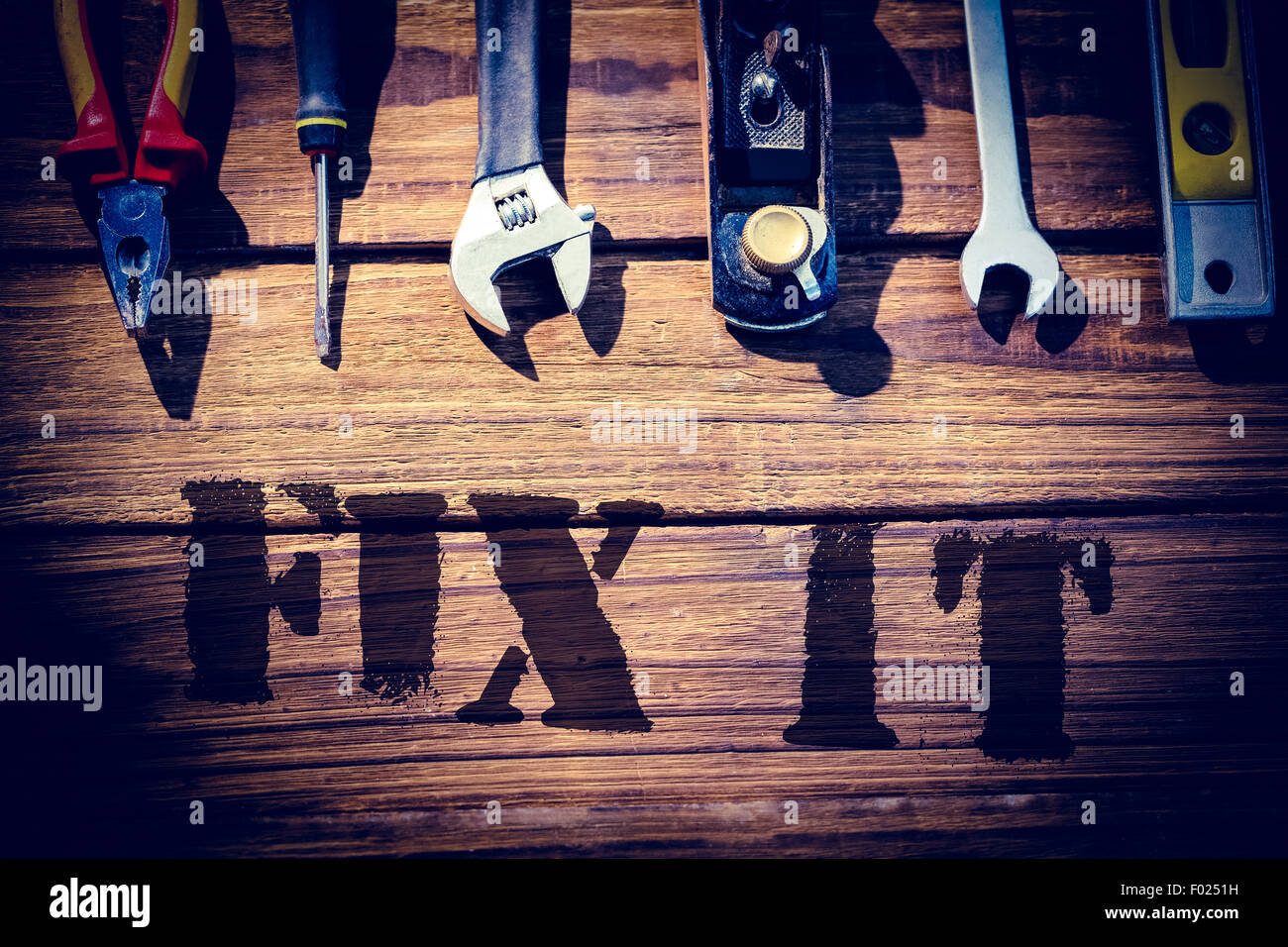 Fix it against desk with tools Stock Photo