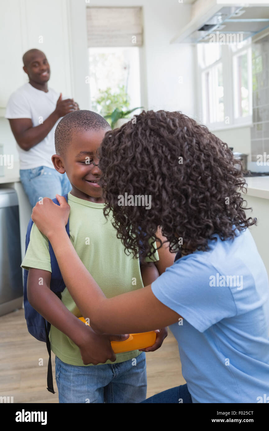 Mother and father prepare his son to going at school Stock Photo