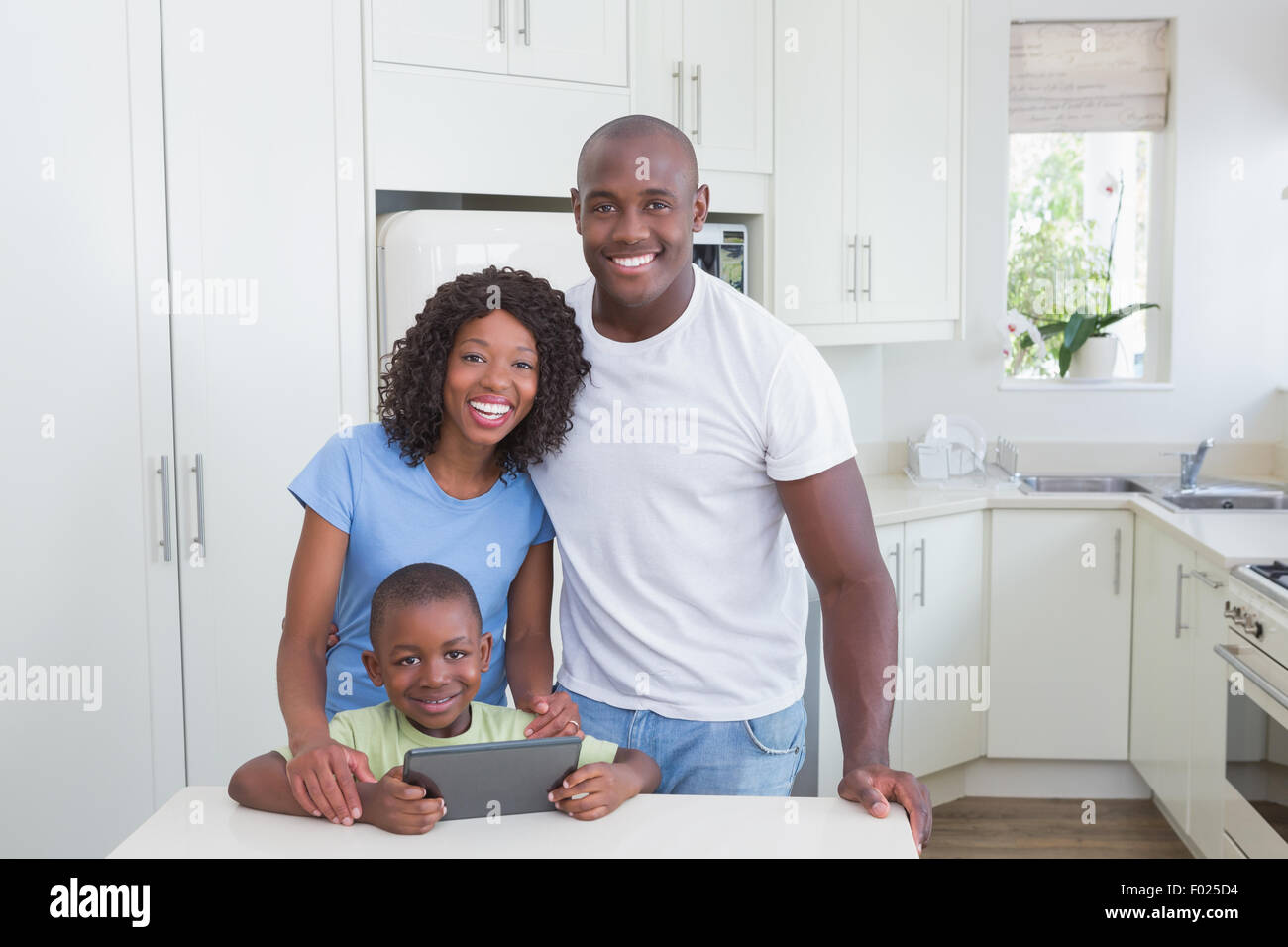 Portrait of a happy smiling family using digital tablet Stock Photo - Alamy