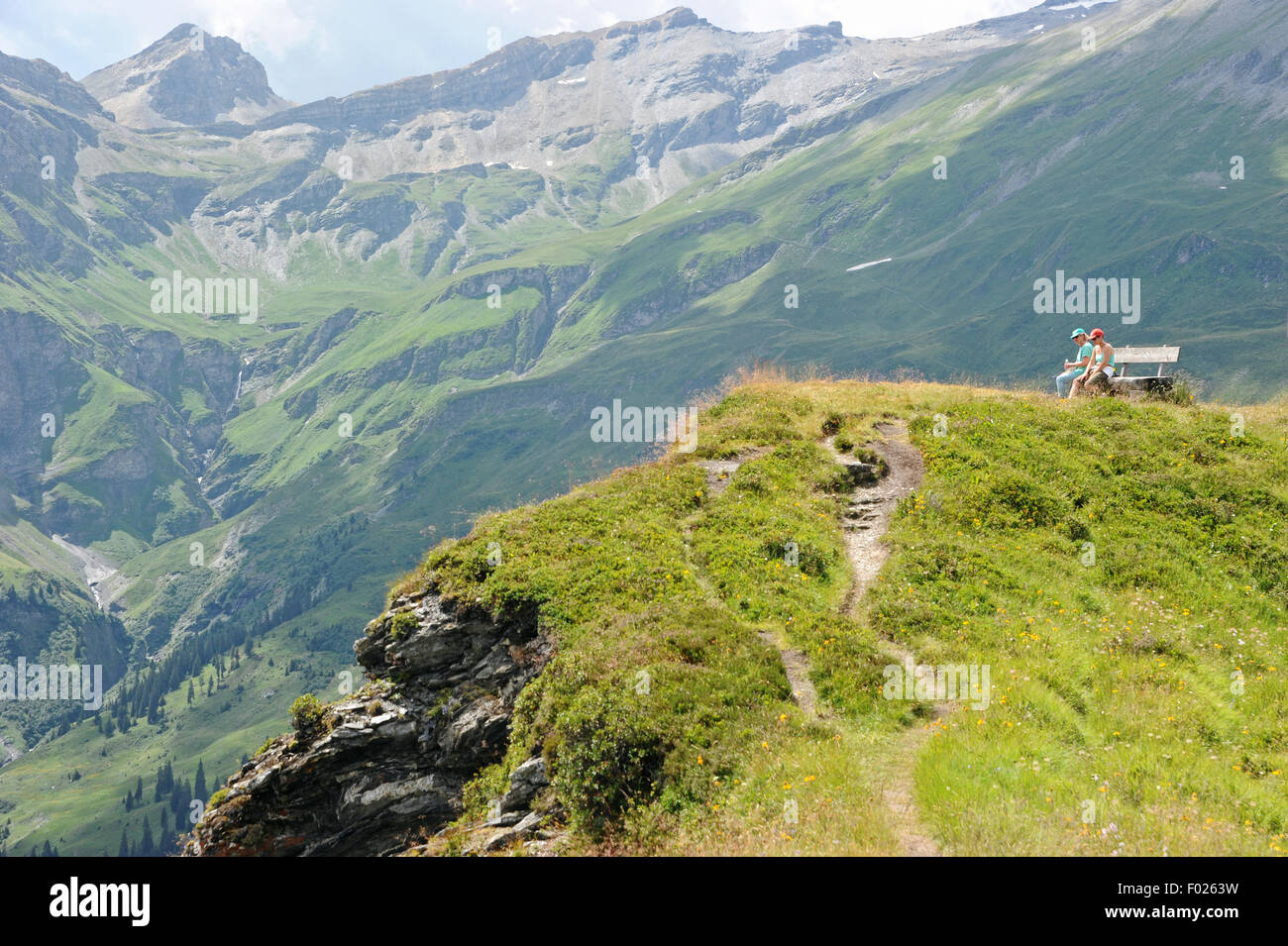 Hiker on the Glaser Grat  in the swiss alps canton Graubuenden. Stock Photo