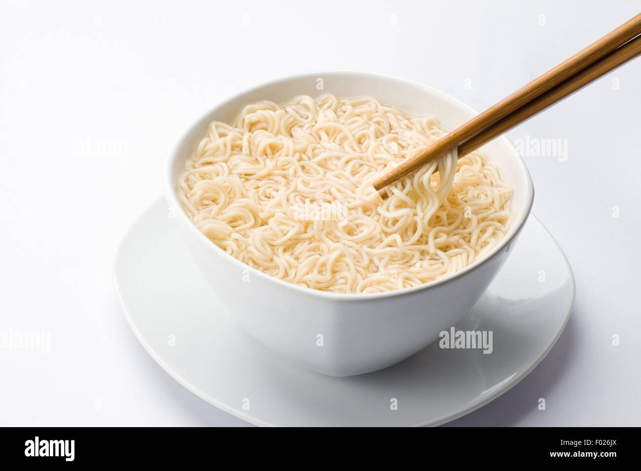 Noodles in bowl and chopsticks Stock Photo
