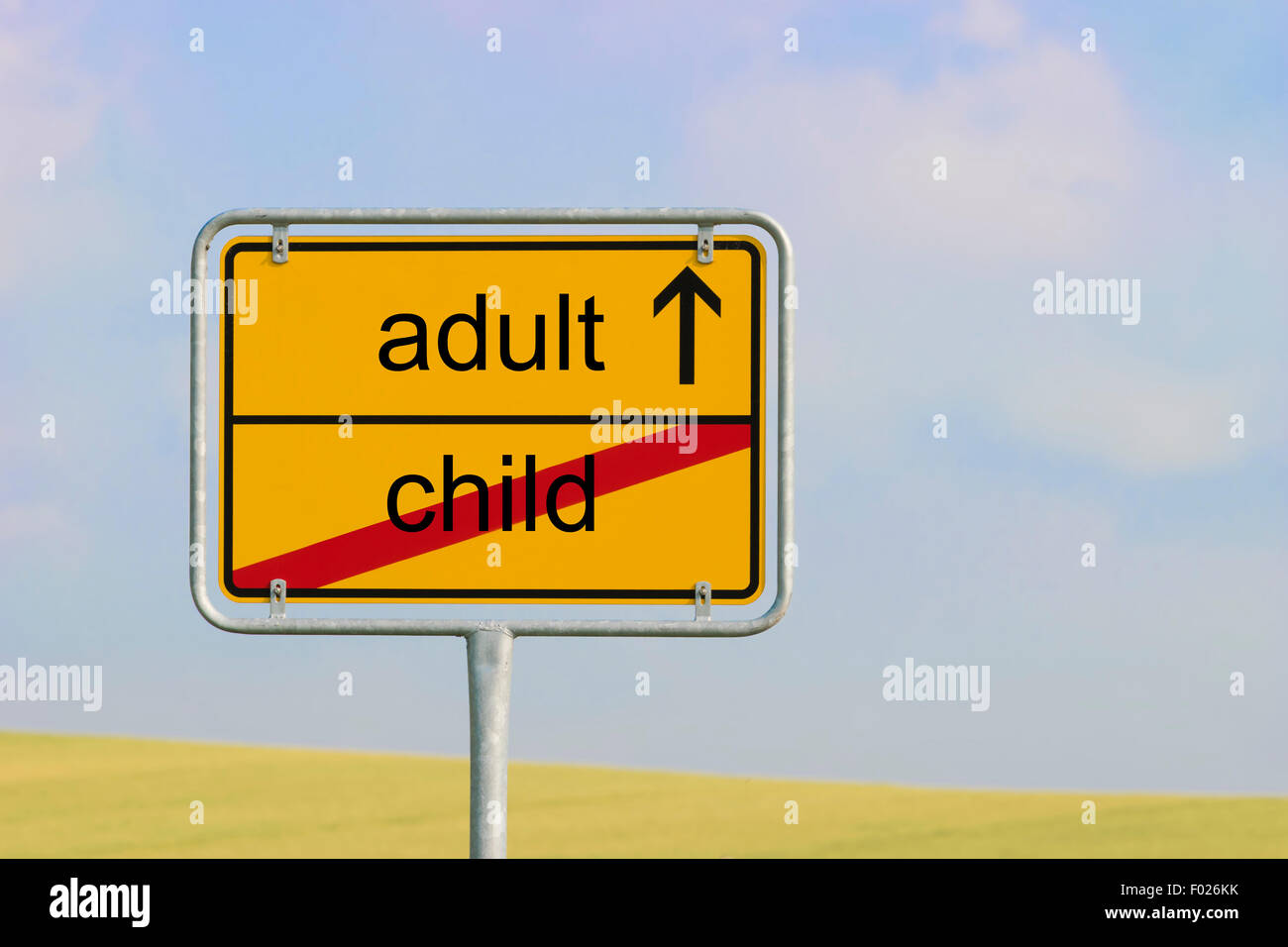 Yellow town sign with text 'child adult' Stock Photo