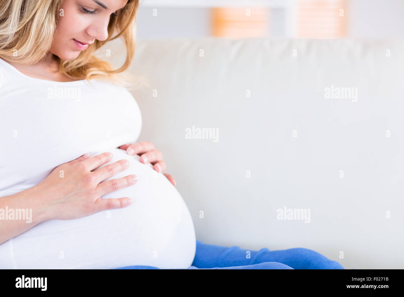 Hands on pregnant belly hires stock photography and images Alamy