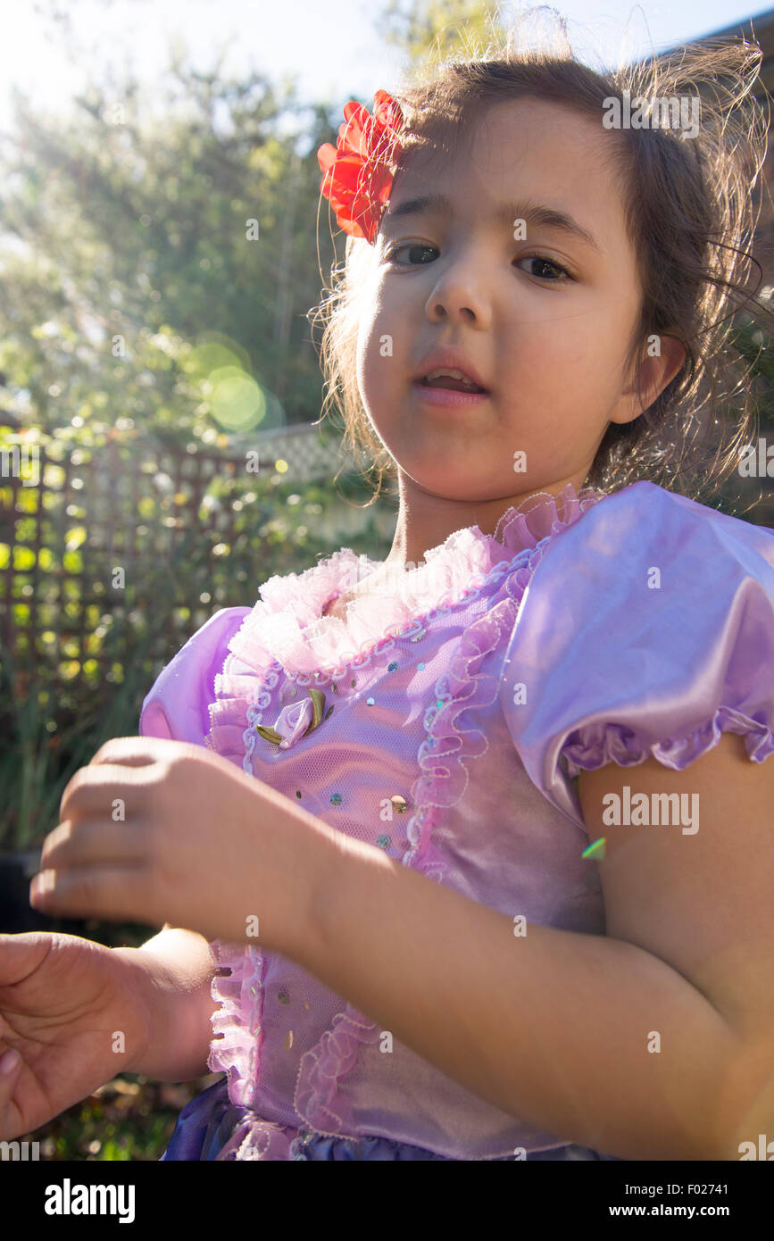 Five year old in a fancy dress in the garden Stock Photo Alamy