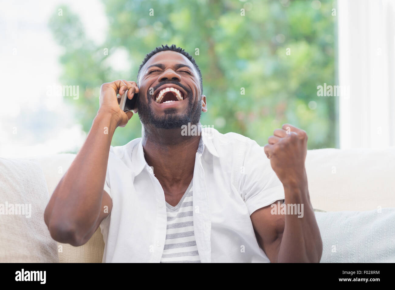 Excited black man hi-res stock photography and images - Alamy