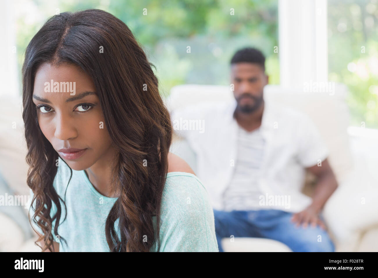 Couple not talking after a dispute on the sofa Stock Photo - Alamy