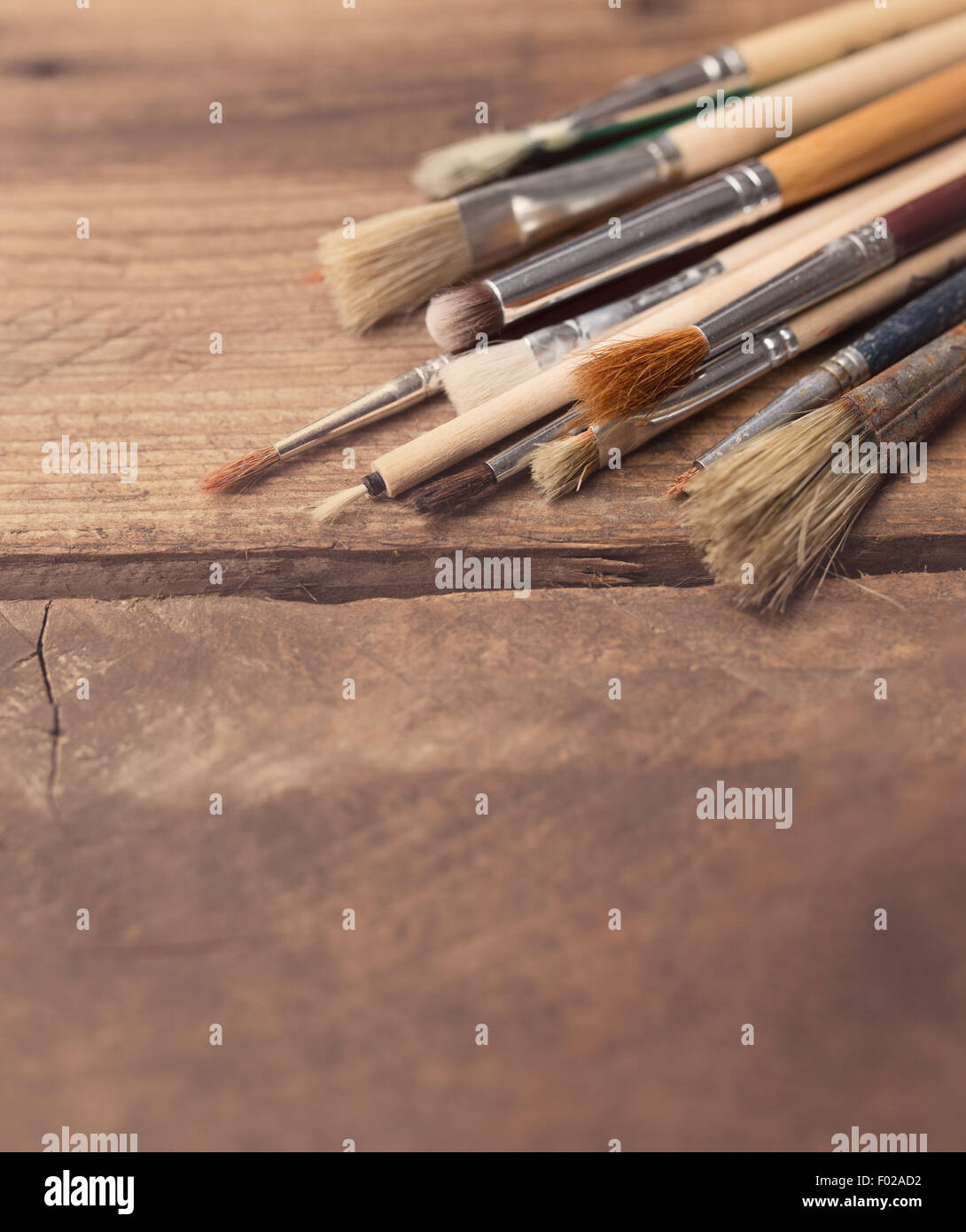 Set of paintbrushes on a wood background Stock Photo