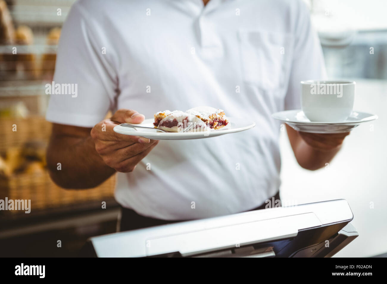 Smiling worker prepares breakfast Stock Photo