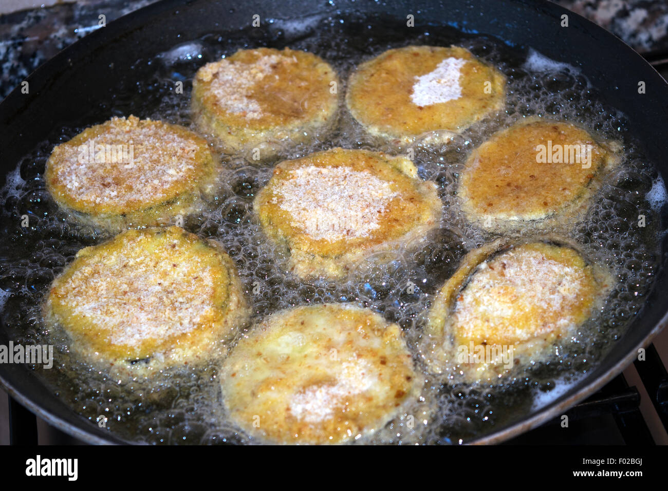slices of breaded eggplants during the fry in a pan Stock Photo Alamy