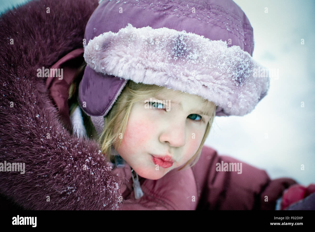 Portrait of a girl looking at camera Stock Photo - Alamy