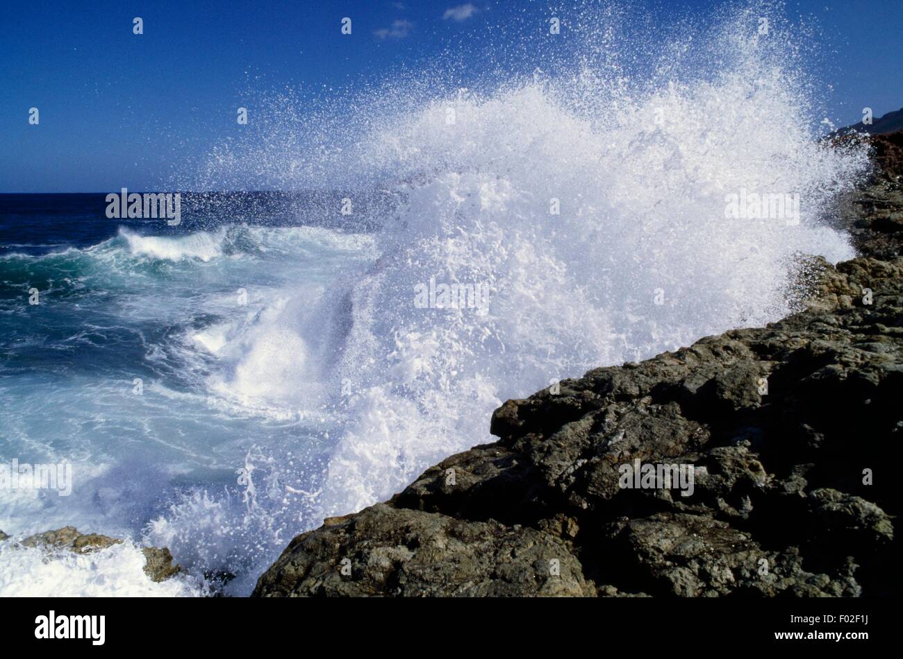 Waves breaking on the rocky coast, Mediterranean Sea Stock Photo - Alamy