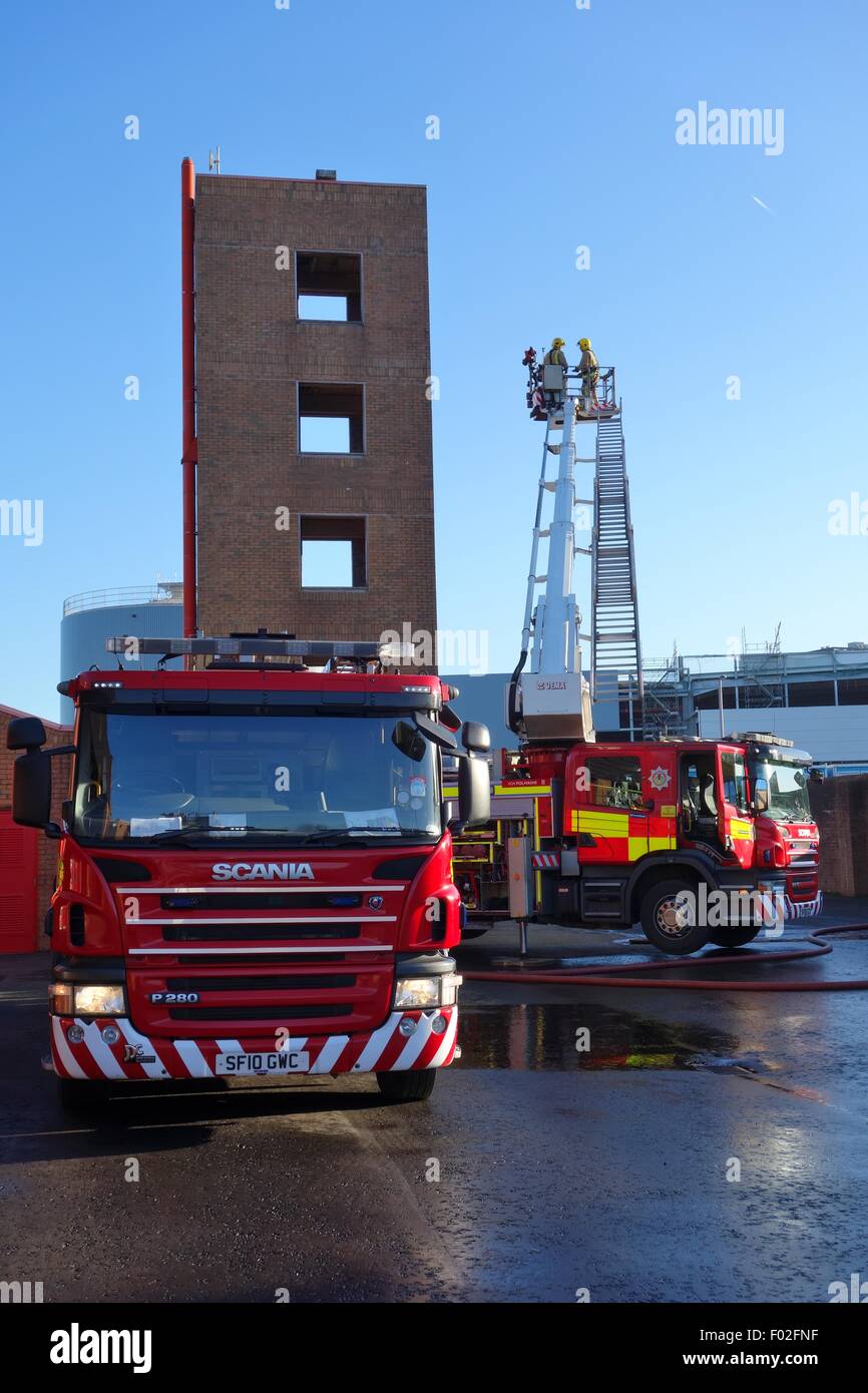 Firefighters training at a fire station drill tower in Glasgow, Scotland, Europe. Stock Photo
