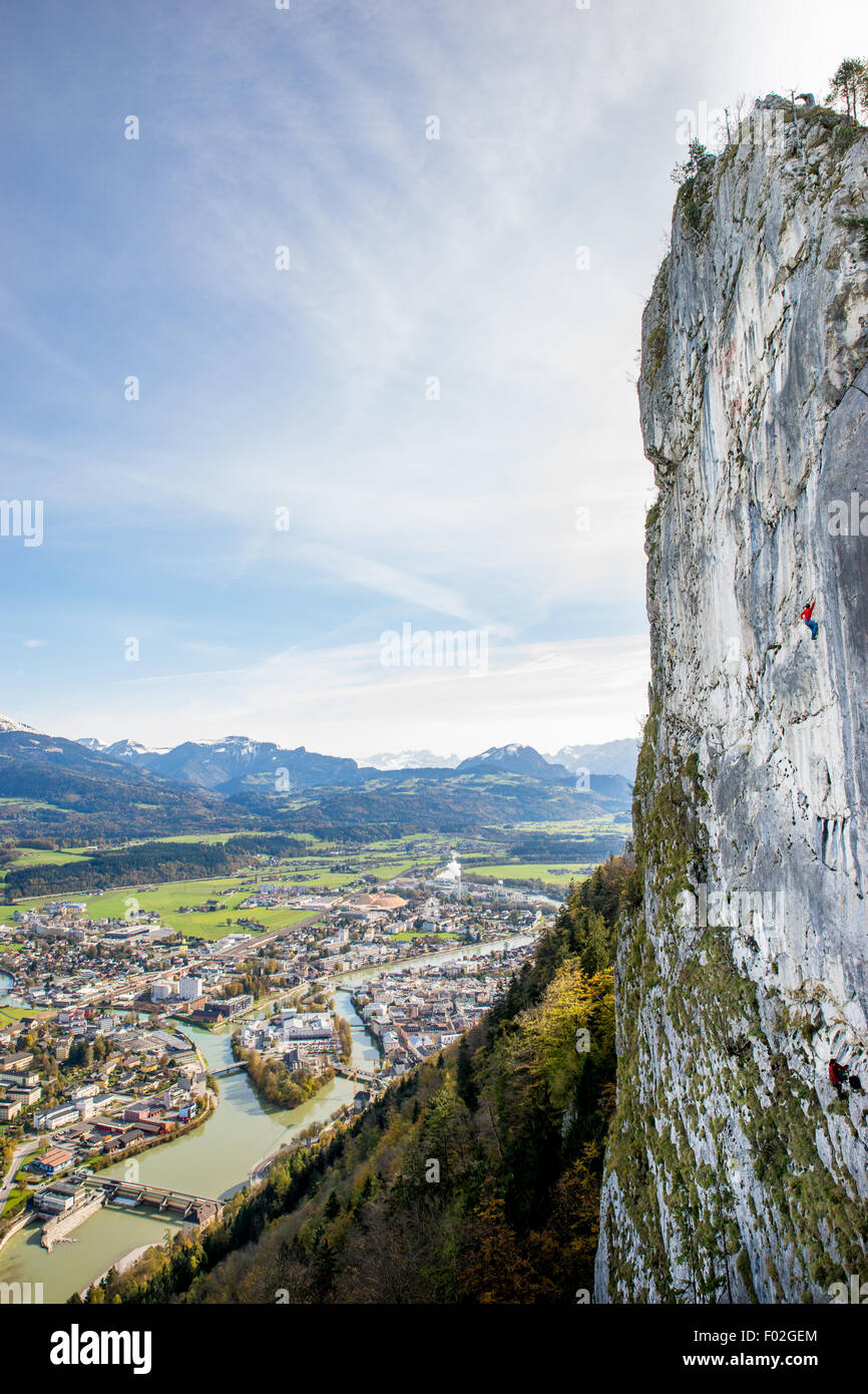 Rock climbing high above the town, Hallein, Salzburg, Austria Stock Photo