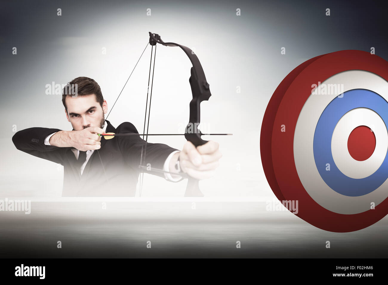 Composite image of smart businessman practicing archery looking at camera Stock Photo