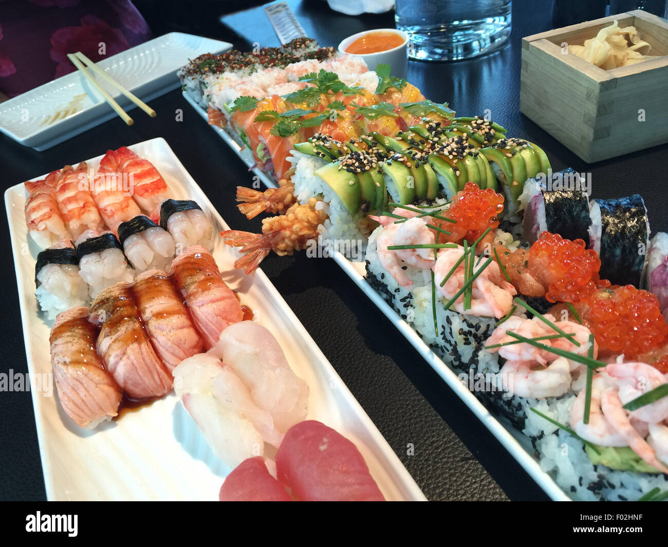 Sushi selection with nigiri and california maki rolls Stock Photo