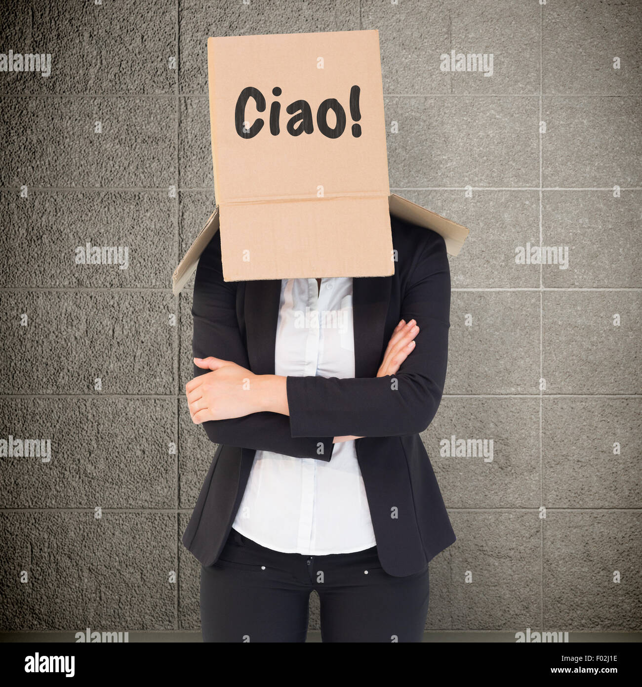 Composite image of businesswoman lifting box off head Stock Photo