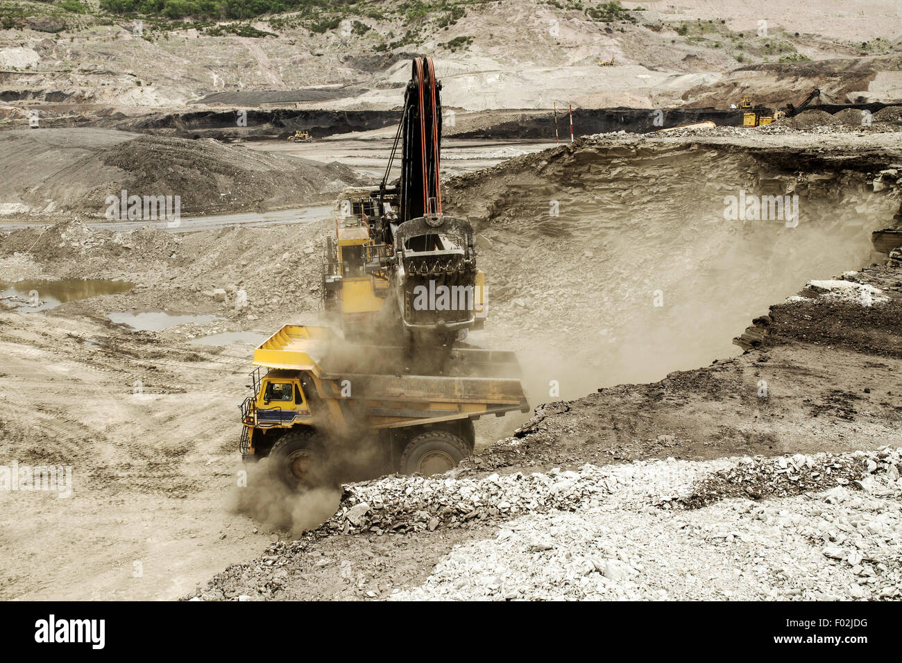 excavator at work in an open-pit mine Stock Photo
