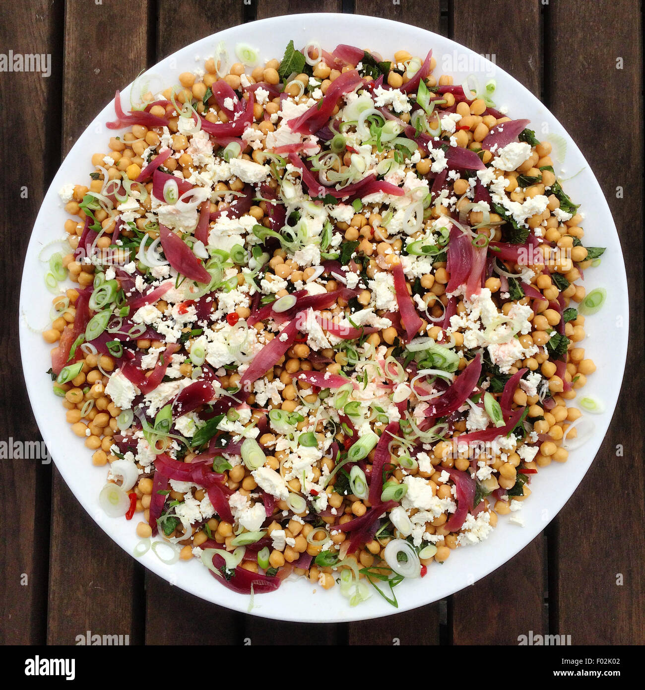 Salad with chickpeas, feta cheese and pickled onions Stock Photo