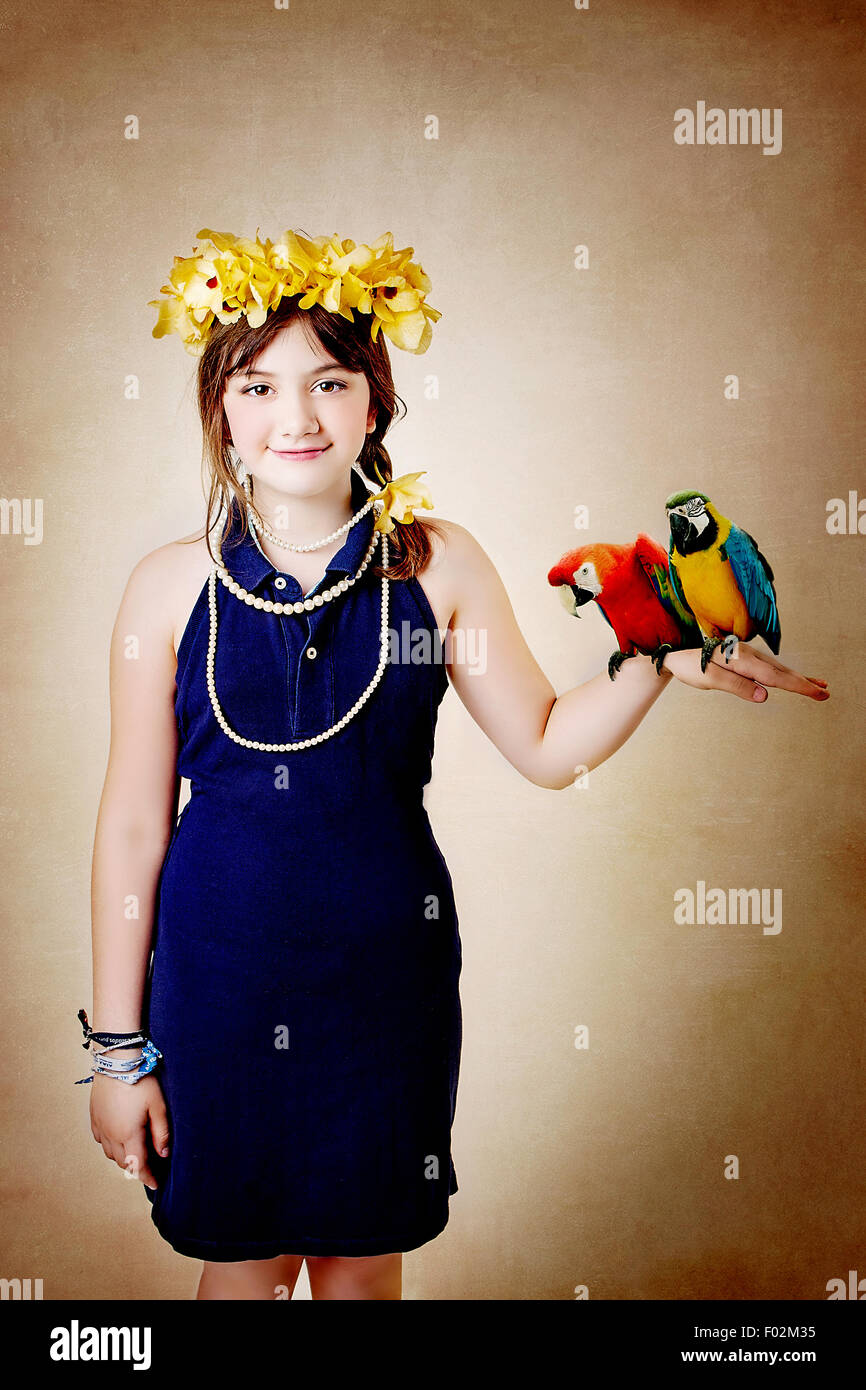 Girl holding two parrots Stock Photo