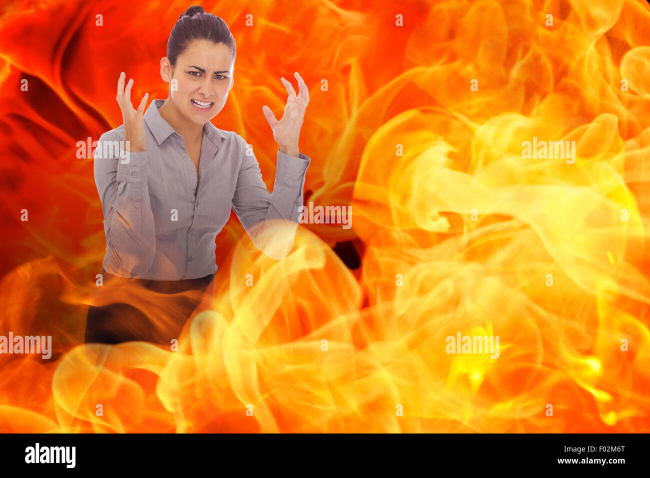 Composite image of frustrated businesswoman shouting Stock Photo