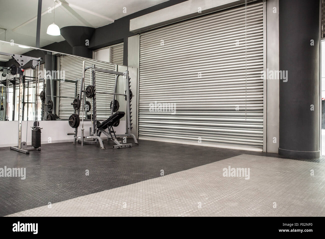 Exercise room with shutters and mirrors Stock Photo Alamy