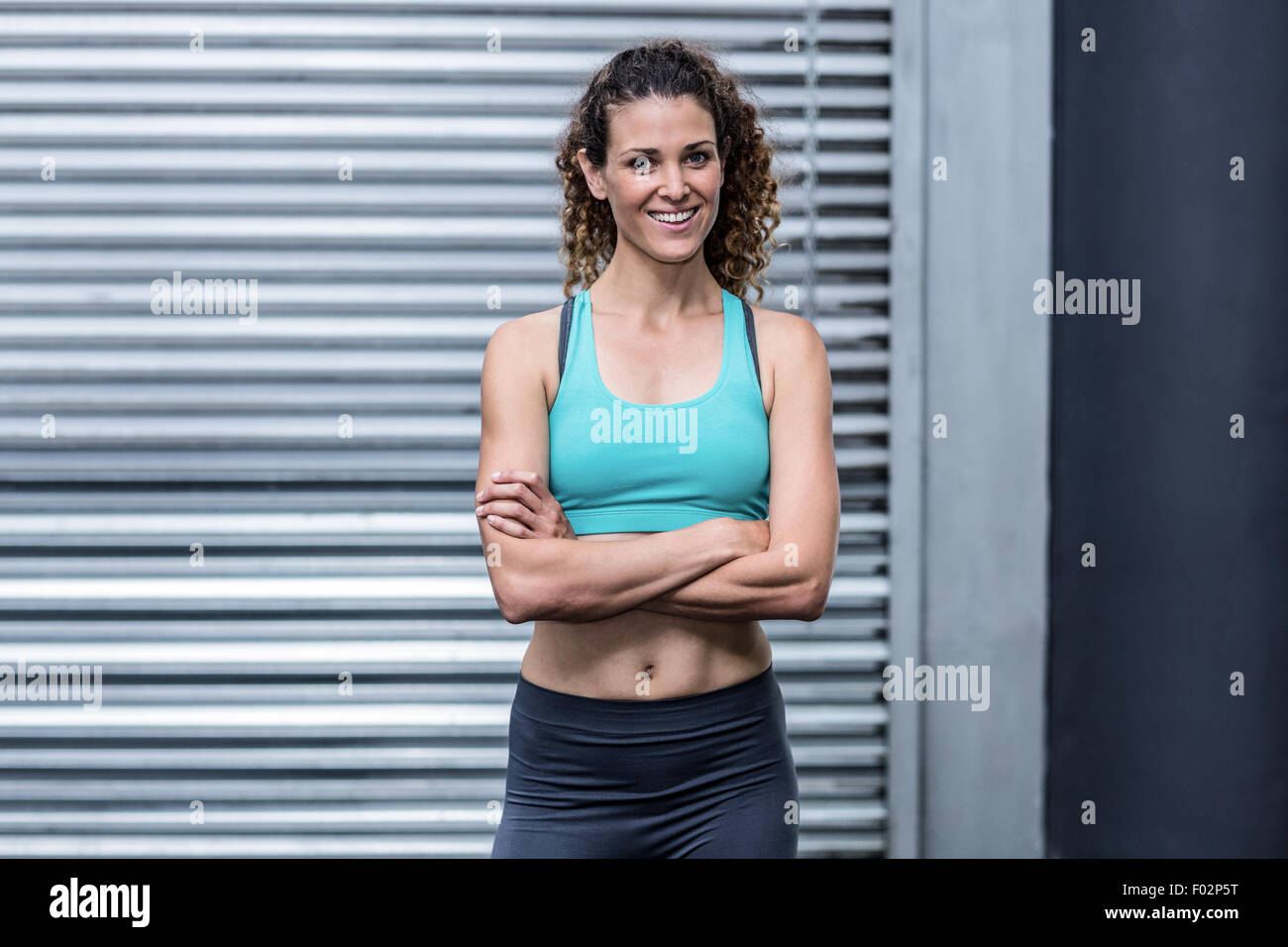 Smiling muscular woman arms crossed hi-res stock photography and images -  Alamy