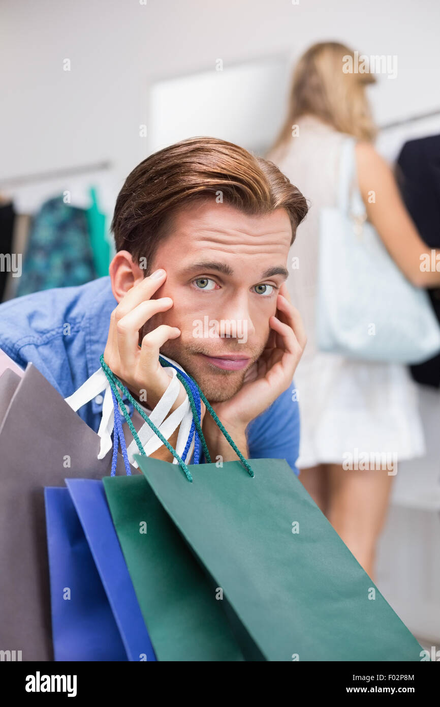 A bored man with his hands under his chin Stock Photo