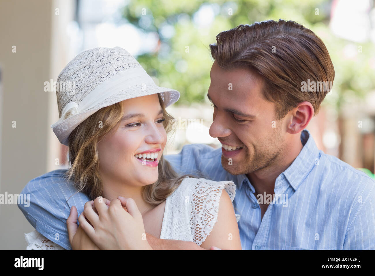 Cute smiling couple looking at each other Stock Photo - Alamy